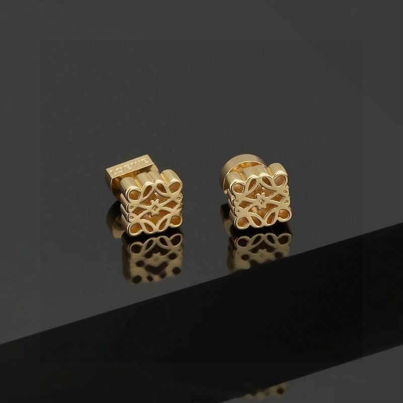 Loewe Anagram stud earrings in gold-tone brass, pair shown on reflective dark surface