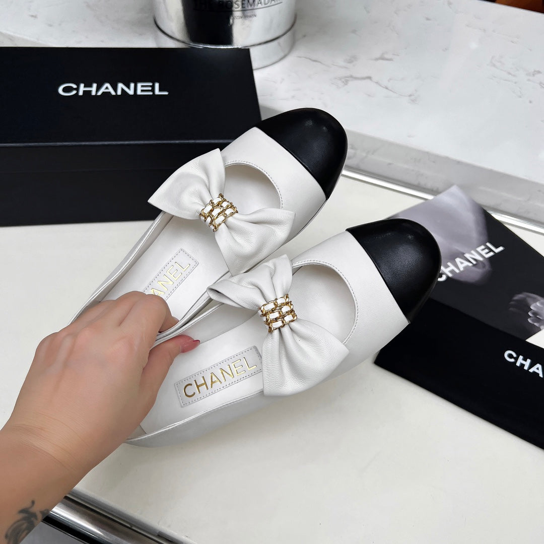 CHANEL 25S MARY JANES IN WHITE MIX BLACK CALFSKIN WITH BOW GOLD HARDWARE